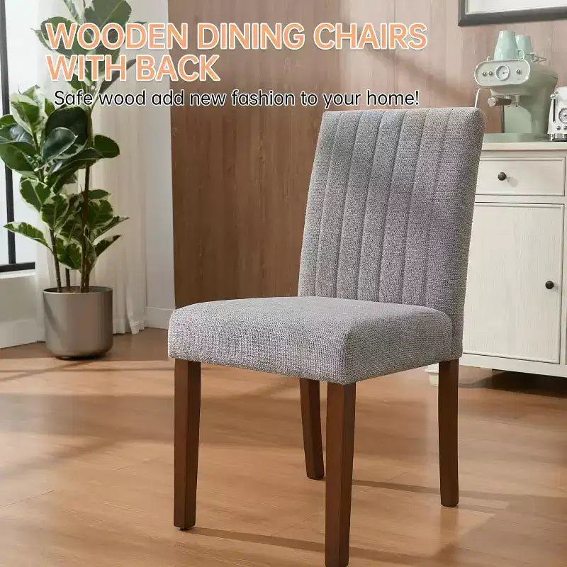 A set of four dining chairs with soft cushions, decorated with buttons, featuring wooden legs and soft seats, suitable for dining rooms kitchens gray