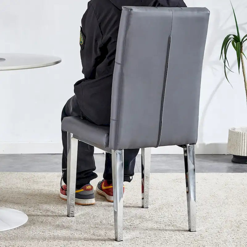 4 piece set of gray armless dining chairs brings a touch of elegance and mystery to the dining area with its deep gray tone
