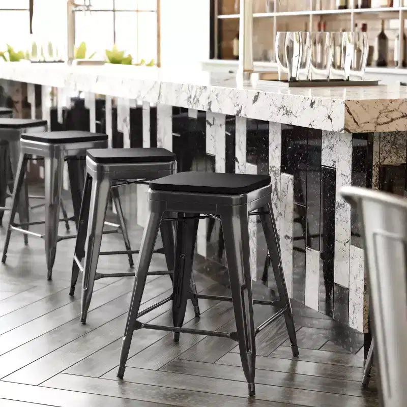 Emma and Oliver Set of Four Backless Metal Stools with All-Weather Poly Resin Seats for Indoor Use Only