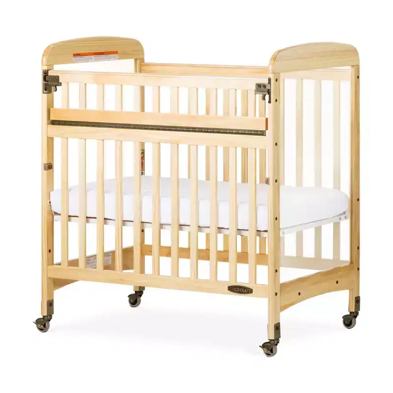 Wooden Compact Portable Crib with SafeAccess Gate, 2 Locking Wheels, ClearView Panels, Fits Through Doorways, Natural